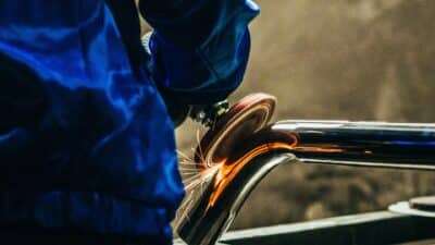 Metal,Polishing,With,A,Hand,Sander,With,A,Polishing,Disk. Polishing