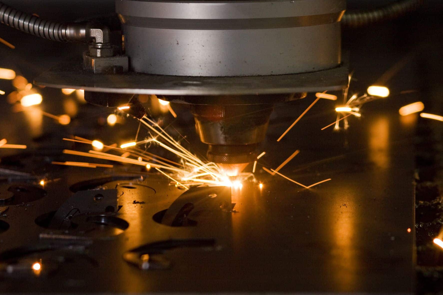 Industrial machinery cutting through metal