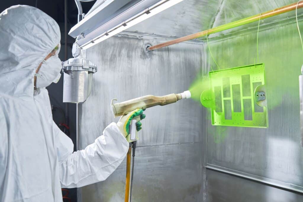 1094360780 specialist powder coating a part in full ppe